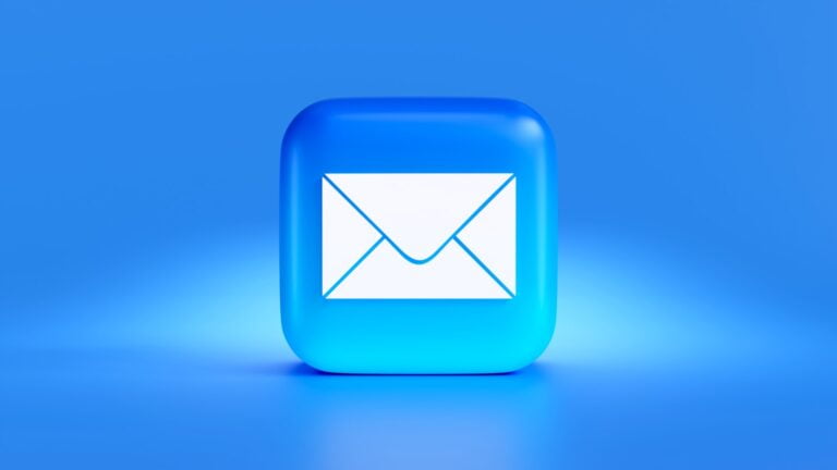 a blue button with a white envelope on it-Email Campaigns