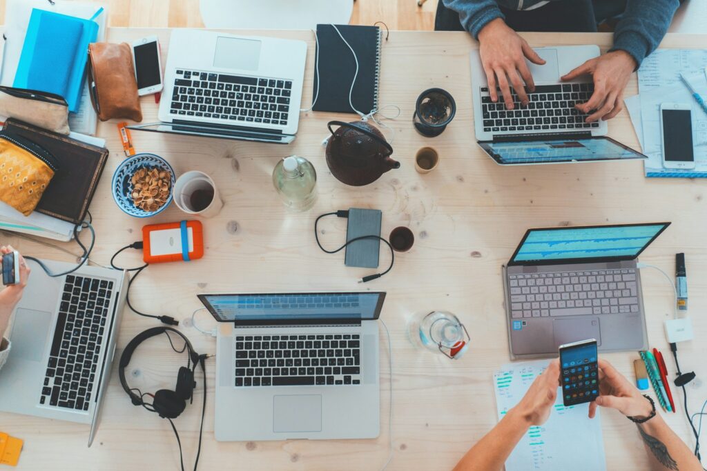 people sitting down near table with assorted laptop computers-Mastering Email Marketing