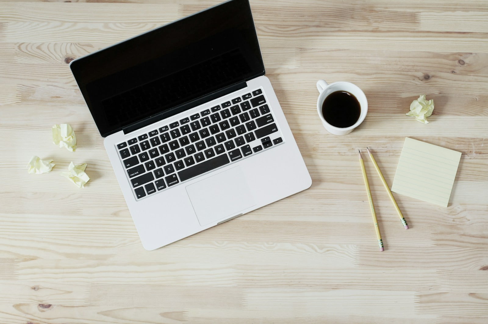 turned off MacBook Pro beside white ceramic mug filled with coffee-Understanding the types of email marketing is crucial for developing a successful email marketing strategy.