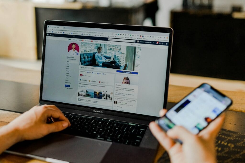 person using both laptop and smartphone-Email Marketing Strategy